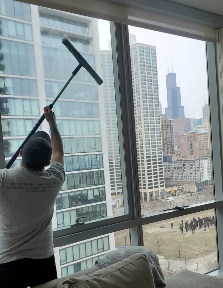 OCD Cleaning employee cleaning interior office windows