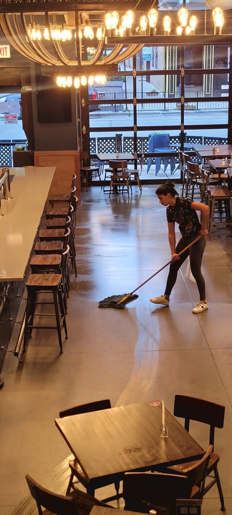 a woman mopping the floor