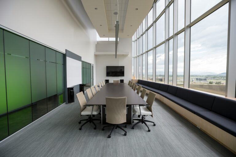 Office cleaning services in West Loop. Large conference room with green accents.