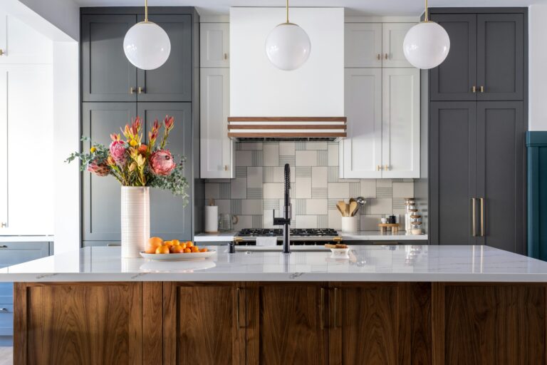 a kitchen with a marble island and flowers. Apartment cleaning in West Loop