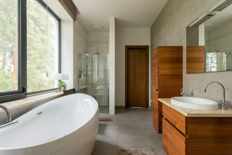 a bathroom with a large tub and a shower.