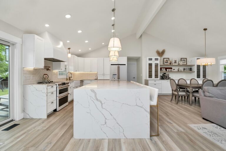 a large kitchen with a marble island. House cleaning services in Irving Park